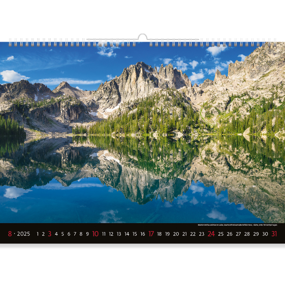 A huge cold lake against a backdrop of mighty mountains. This forest landscape gives a sense of calm and peace. Enjoy the cosiness and coolness of the forest with our Mountain view calendar 2025