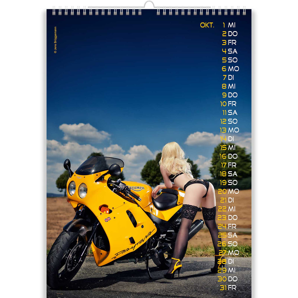Hot Blonde Bends Over to Her Yellow Motorcycle in Nude Bike Calendar