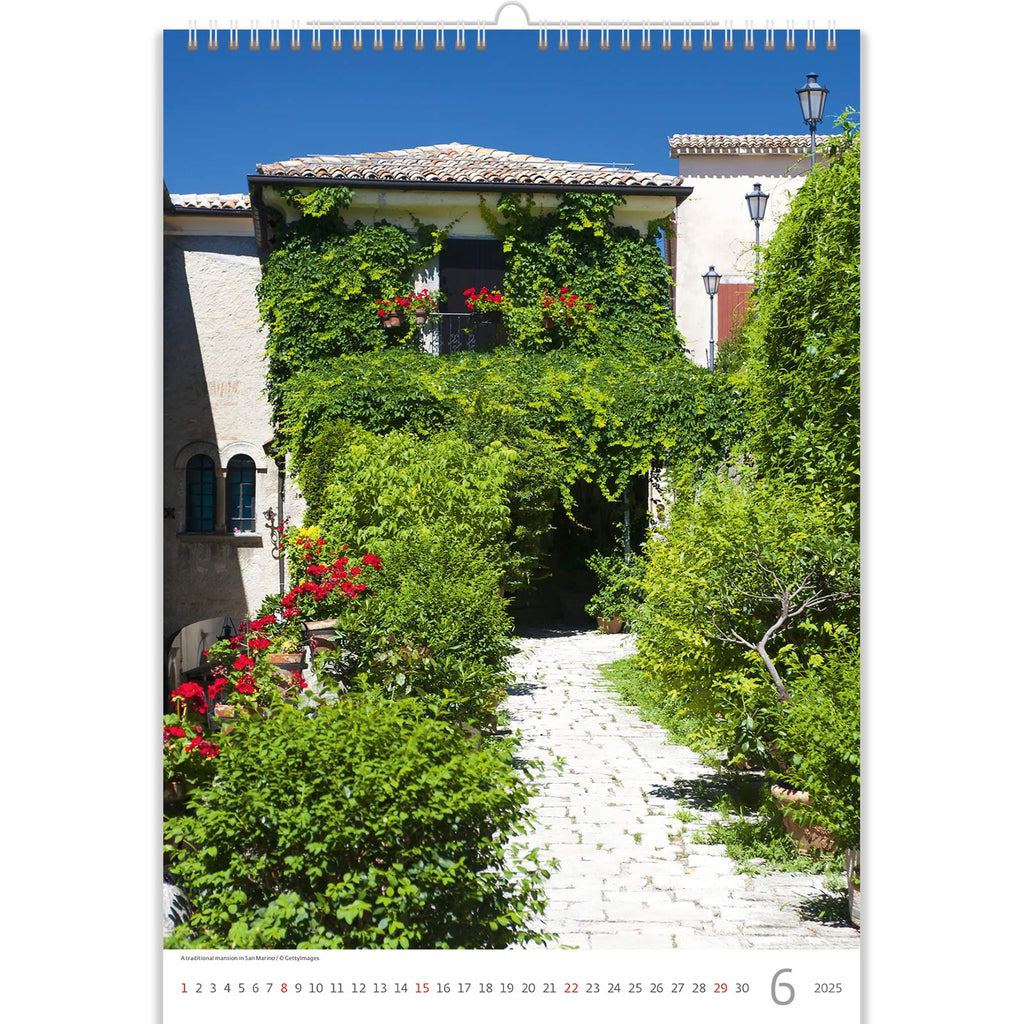 June in the Romantic Calendar 2025 unveils a secluded garden path embraced by lush greenery and blooms. This idyllic scene captures the essence of summer romance, inviting wanderers to immerse themselves in the beauty of nature's embrace, where every step is a journey of serenity and enchantment.