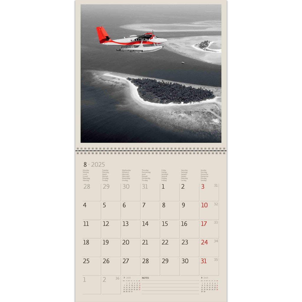 A lonely red helicopter scatters the airy expanse of the seashore. Appreciate its freedom in our Black Red Calendar 2025!