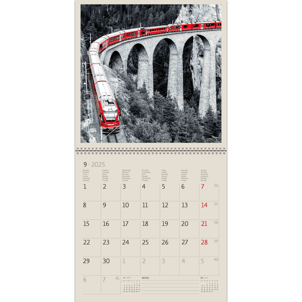 A red train transports its passengers that are in search of adventure. A beautiful picture in our Black Red Calendar 2025!